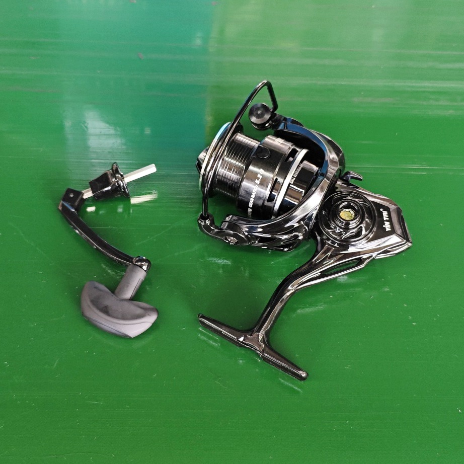 a black Chinese fishing reel with handles